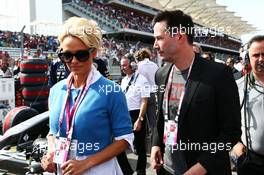 (L to R): Pamela Anderson (USA) Actress with Keanu Reeves (USA) Actor on the grid. 02.11.2014. Formula 1 World Championship, Rd 17, United States Grand Prix, Austin, Texas, USA, Race Day.
