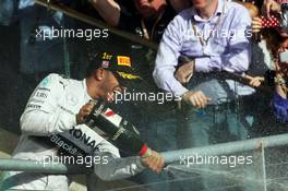 Race winner Lewis Hamilton (GBR) Mercedes AMG F1 celebrates on the podium. 02.11.2014. Formula 1 World Championship, Rd 17, United States Grand Prix, Austin, Texas, USA, Race Day.