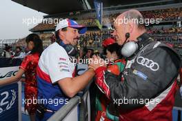 (L to R): Rob Leupen (NDL) Toyota Racing Director Business Operations with Dr. Wolfgang Ullrich (GER) Audi Motorsport Team Boss on the grid. 02.11.2014. FIA World Endurance Championship, Round 6, Six Hours of Shanghai, Shanghai, China, Sunday.