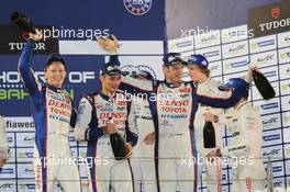 (L to R): Race winners Mike Conway (GBR); Stephane Sarrazin (FRA); and Alexander Wurz (AUT) #07 Toyota Racing Toyota TS040 Hybrid celebrate on the podium. 15.11.2014. FIA World Endurance Championship, Round 7, Six Hours of Bahrain, Sakhir, Bahrain, Saturday.