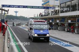 An ambulance comes into the pit lane after Mark Webber (AUS) #20 Porsche Team Porsche 919 Hybrid crashed out of the race. 30.11.2014. FIA World Endurance Championship, Round 8, Six Hours of Sao Paulo, Interlagos, Sao Paulo, Brazil. Sunday.