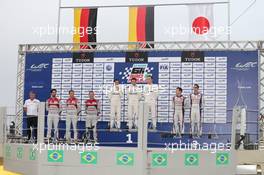 The podium (L to R): Lucas di Grassi (BRA);  Loïc Duval (FRA); Tom Kristensen (DEN) #01 Audi Sport Team Joest Audi R18 e-tron quattro Hybrid, third; Neel Jani (SUI); Romain Dumas (FRA); Marc Lieb (GER) #14 Porsche Team Porsche 919 Hybrid, race winners; Anthony Davidson (GBR);  Sebastien Buemi (SUI) #08 Toyota Racing Toyota TS040 Hybrid, second. 30.11.2014. FIA World Endurance Championship, Round 8, Six Hours of Sao Paulo, Interlagos, Sao Paulo, Brazil. Sunday.