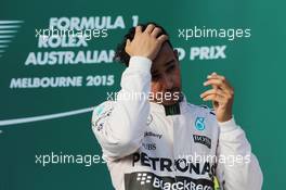 Race winner Lewis Hamilton (GBR) Mercedes AMG F1 celebrates on the podium. 15.03.2015. Formula 1 World Championship, Rd 1, Australian Grand Prix, Albert Park, Melbourne, Australia, Race Day.