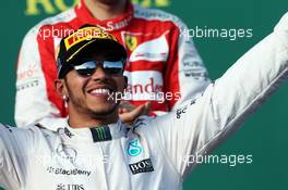 Race winner Lewis Hamilton (GBR) Mercedes AMG F1 celebrates on the podium. 15.03.2015. Formula 1 World Championship, Rd 1, Australian Grand Prix, Albert Park, Melbourne, Australia, Race Day.