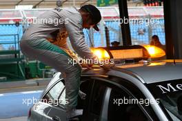 Lewis Hamilton (GBR) Mercedes AMG F1 jumping out of the medical car. 14.03.2015. Formula 1 World Championship, Rd 1, Australian Grand Prix, Albert Park, Melbourne, Australia, Qualifying Day.