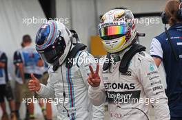 (L to R): Valtteri Bottas (FIN) Williams with pole sitter Lewis Hamilton (GBR) Mercedes AMG F1 in parc ferme. 14.03.2015. Formula 1 World Championship, Rd 1, Australian Grand Prix, Albert Park, Melbourne, Australia, Qualifying Day.