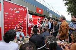 Sebastian Vettel (GER) Ferrari with the media. 14.03.2015. Formula 1 World Championship, Rd 1, Australian Grand Prix, Albert Park, Melbourne, Australia, Qualifying Day.