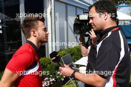 Will Stevens (GBR) Manor F1 Team with Ted Kravitz (GBR) Sky Sports Pitlane Reporter. 12.03.2015. Formula 1 World Championship, Rd 1, Australian Grand Prix, Albert Park, Melbourne, Australia, Preparation Day.