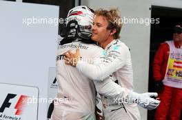 Race winner Nico Rosberg (GER) Mercedes AMG F1 celebrates with team mate Lewis Hamilton (GBR) Mercedes AMG F1 in parc ferme. 21.06.2015. Formula 1 World Championship, Rd 8, Austrian Grand Prix, Spielberg, Austria, Race Day.