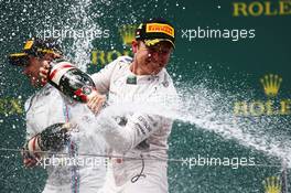 Race winner Nico Rosberg (GER) Mercedes AMG F1 celebrates with the champagne on the podium. 21.06.2015. Formula 1 World Championship, Rd 8, Austrian Grand Prix, Spielberg, Austria, Race Day.