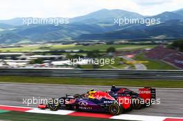 Daniil Kvyat (RUS) Red Bull Racing RB11 and Max Verstappen (NLD) Scuderia Toro Rosso STR10 battle for position. 21.06.2015. Formula 1 World Championship, Rd 8, Austrian Grand Prix, Spielberg, Austria, Race Day.