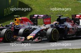 Daniil Kvyat (RUS) Red Bull Racing RB11 and Max Verstappen (NLD) Scuderia Toro Rosso STR10 battle for position. 21.06.2015. Formula 1 World Championship, Rd 8, Austrian Grand Prix, Spielberg, Austria, Race Day.