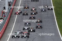 (L to R): Nico Rosberg (GER) Mercedes AMG F1 W06 and Lewis Hamilton (GBR) Mercedes AMG F1 W06 battle at the start of the race. 21.06.2015. Formula 1 World Championship, Rd 8, Austrian Grand Prix, Spielberg, Austria, Race Day.