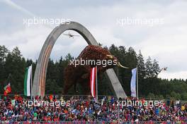 Hannes Arch (AUT) air display, passing over the grandstand and Red Bull iron sculpture. 21.06.2015. Formula 1 World Championship, Rd 8, Austrian Grand Prix, Spielberg, Austria, Race Day.
