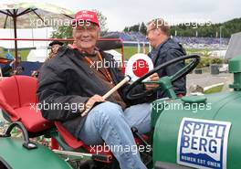 Niki Lauda (AUT) Mercedes Non-Executive Chairman on a tractor. 20.06.2015. Formula 1 World Championship, Rd 8, Austrian Grand Prix, Spielberg, Austria, Qualifying Day.