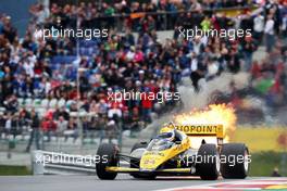 Pierluigi Martini (ITA) in the Minardi M186-01 at the Legends Parade suffers a fire. 21.06.2015. Formula 1 World Championship, Rd 8, Austrian Grand Prix, Spielberg, Austria, Race Day.