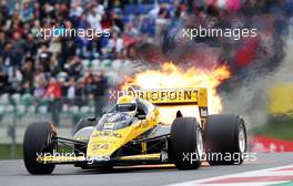 Pierluigi Martini (ITA) in the Minardi M186-01 at the Legends Parade suffers a fire. 21.06.2015. Formula 1 World Championship, Rd 8, Austrian Grand Prix, Spielberg, Austria, Race Day.