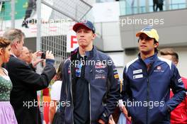 (L to R): Daniil Kvyat (RUS) Red Bull Racing with Felipe Nasr (BRA) Sauber F1 Team on the drivers parade. 21.06.2015. Formula 1 World Championship, Rd 8, Austrian Grand Prix, Spielberg, Austria, Race Day.