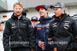 (L to R): Jenson Button (GBR) McLaren with Daniel Ricciardo (AUS) Red Bull Racing and Sergio Perez (MEX) Sahara Force India F1 on the drivers parade. 21.06.2015. Formula 1 World Championship, Rd 8, Austrian Grand Prix, Spielberg, Austria, Race Day.