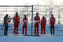 Sebastian Vettel (GER) Ferrari (Right) watches the action with members of the team. 20.02.2015. Formula One Testing, Day Two, Barcelona, Spain.