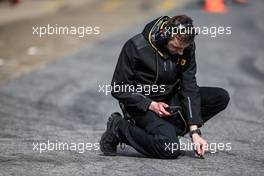 Pirelli tyre techncian takes a track temperature reading. 26.02.2015. Formula One Testing, Day One, Barcelona, Spain.