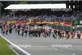Fans invade the circuit to head to the podium. 23.08.2015. Formula 1 World Championship, Rd 13, Belgian Grand Prix, Spa Francorchamps, Belgium, Race Day.