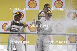 (L to R): Race winner Lewis Hamilton (GBR) Mercedes AMG F1 and second placed team mate Nico Rosberg (GER) Mercedes AMG F1 celebrate on the podium. 23.08.2015. Formula 1 World Championship, Rd 13, Belgian Grand Prix, Spa Francorchamps, Belgium, Race Day.