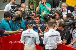 Lewis Hamilton (GBR) Mercedes AMG F1 with Will Buxton (GBR) NBC Sports Network TV Presenter. 23.08.2015. Formula 1 World Championship, Rd 13, Belgian Grand Prix, Spa Francorchamps, Belgium, Race Day.