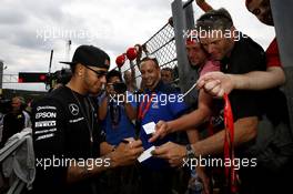 Lewis Hamilton (GBR) Mercedes AMG F1 signs autographs for the fans. 23.08.2015. Formula 1 World Championship, Rd 13, Belgian Grand Prix, Spa Francorchamps, Belgium, Race Day.