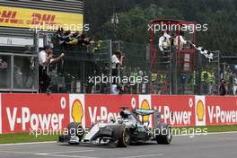 Race winner Lewis Hamilton (GBR) Mercedes AMG F1 W06 celebrates as he takes the chequered flag at the end of the race. 23.08.2015. Formula 1 World Championship, Rd 13, Belgian Grand Prix, Spa Francorchamps, Belgium, Race Day.
