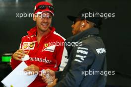 (L to R): Sebastian Vettel (GER) Ferrari with Lewis Hamilton (GBR) Mercedes AMG F1. 23.08.2015. Formula 1 World Championship, Rd 13, Belgian Grand Prix, Spa Francorchamps, Belgium, Race Day.
