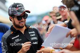 Sergio Perez (MEX) Sahara Force India F1 signs autographs for the fans. 20.08.2015. Formula 1 World Championship, Rd 11, Belgian Grand Prix, Spa Francorchamps, Belgium, Preparation Day.
