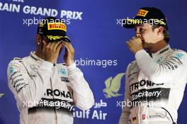 The podium (L to R): Race winner Lewis Hamilton (GBR) Mercedes AMG F1 with third placed team mate Nico Rosberg (GER) Mercedes AMG F1. 19.04.2015. Formula 1 World Championship, Rd 4, Bahrain Grand Prix, Sakhir, Bahrain, Race Day.
