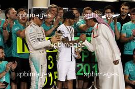 Third placed Nico Rosberg (GER) Mercedes AMG F1 and race winner Lewis Hamilton (GBR) Mercedes AMG F1 celebrate with the team. 19.04.2015. Formula 1 World Championship, Rd 4, Bahrain Grand Prix, Sakhir, Bahrain, Race Day.