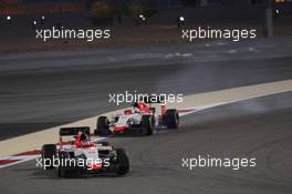 Roberto Merhi (ESP) Manor Marussia F1 Team leads Will Stevens (GBR) Manor Marussia F1 Team. 19.04.2015. Formula 1 World Championship, Rd 4, Bahrain Grand Prix, Sakhir, Bahrain, Race Day.