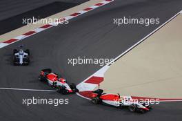 Roberto Merhi (ESP) Manor Marussia F1 Team leads Will Stevens (GBR) Manor Marussia F1 Team and Felipe Massa (BRA) Williams FW37 at the start of the race. 19.04.2015. Formula 1 World Championship, Rd 4, Bahrain Grand Prix, Sakhir, Bahrain, Race Day.