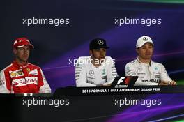 The post qualifying FIA Press Conference (L to R): Sebastian Vettel (GER) Ferrari, second; Lewis Hamilton (GBR) Mercedes AMG F1, pole position; Nico Rosberg (GER) Mercedes AMG F1, third. 18.04.2015. Formula 1 World Championship, Rd 4, Bahrain Grand Prix, Sakhir, Bahrain, Qualifying Day.