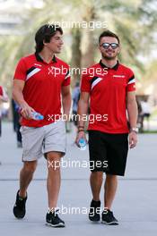 (L to R): Roberto Merhi (ESP) Manor Marussia F1 Team with team mate Will Stevens (GBR) Manor Marussia F1 Team. 19.04.2015. Formula 1 World Championship, Rd 4, Bahrain Grand Prix, Sakhir, Bahrain, Race Day.