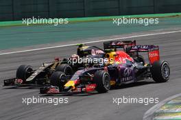 Daniil Kvyat (RUS) Red Bull Racing RB11 and Pastor Maldonado (VEN) Lotus F1 E23 battle for position. 15.11.2015. Formula 1 World Championship, Rd 18, Brazilian Grand Prix, Sao Paulo, Brazil, Race Day.