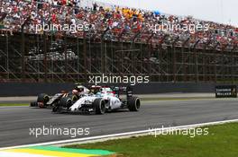Felipe Massa (BRA) Williams FW37 and Romain Grosjean (FRA) Lotus F1 E23 battle for position. 15.11.2015. Formula 1 World Championship, Rd 18, Brazilian Grand Prix, Sao Paulo, Brazil, Race Day.