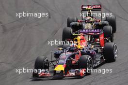 Daniil Kvyat (RUS) Red Bull Racing RB11 leads Pastor Maldonado (VEN) Lotus F1 E23. 15.11.2015. Formula 1 World Championship, Rd 18, Brazilian Grand Prix, Sao Paulo, Brazil, Race Day.