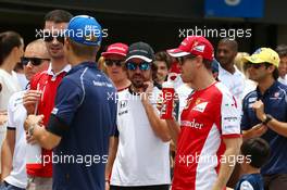 (L to R): Fernando Alonso (ESP) McLaren with Sebastian Vettel (GER) Ferrari on the drivers parade. 15.11.2015. Formula 1 World Championship, Rd 18, Brazilian Grand Prix, Sao Paulo, Brazil, Race Day.