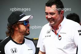 (L to R): Fernando Alonso (ESP) McLaren with Eric Boullier (FRA) McLaren Racing Director at a team photograph. 12.11.2015. Formula 1 World Championship, Rd 18, Brazilian Grand Prix, Sao Paulo, Brazil, Preparation Day.