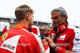 Sebastian Vettel (GER) Ferrari with Maurizio Arrivabene (ITA) Ferrari Team Principal on the grid. 07.06.2015. Formula 1 World Championship, Rd 7, Canadian Grand Prix, Montreal, Canada, Race Day.