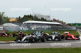 Lewis Hamilton (GBR) Mercedes AMG F1 W06 leads at the start of the race. 07.06.2015. Formula 1 World Championship, Rd 7, Canadian Grand Prix, Montreal, Canada, Race Day.