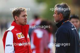 (L to R): Sebastian Vettel (GER) Ferrari with Beat Zehnder (SUI) Sauber F1 Team Manager. 10.04.2015. Formula 1 World Championship, Rd 3, Chinese Grand Prix, Shanghai, China, Practice Day.
