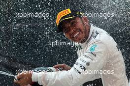 Race winner Lewis Hamilton (GBR) Mercedes AMG F1 celebrates on the podium. 12.04.2015. Formula 1 World Championship, Rd 3, Chinese Grand Prix, Shanghai, China, Race Day.