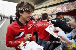 Roberto Merhi (ESP) Manor Marussia F1 Team signs autographs for the fans. 09.04.2015. Formula 1 World Championship, Rd 3, Chinese Grand Prix, Shanghai, China, Preparation Day.