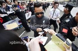Lewis Hamilton (GBR) Mercedes AMG F1 signs autographs for the fans. 09.04.2015. Formula 1 World Championship, Rd 3, Chinese Grand Prix, Shanghai, China, Preparation Day.