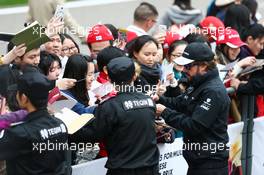 Fernando Alonso (ESP) McLaren signs autographs for the fans. 09.04.2015. Formula 1 World Championship, Rd 3, Chinese Grand Prix, Shanghai, China, Preparation Day.